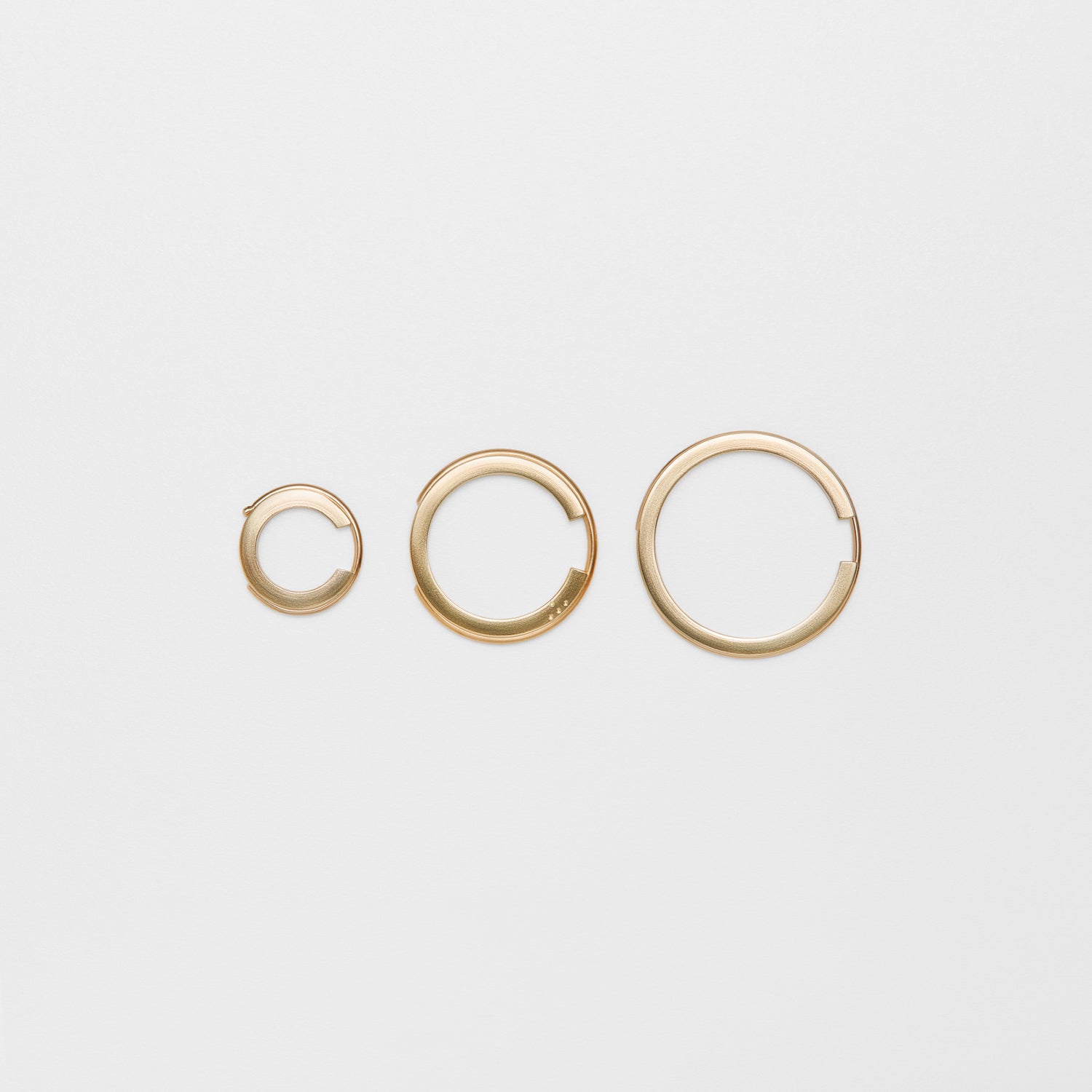 CO gold hoop earring